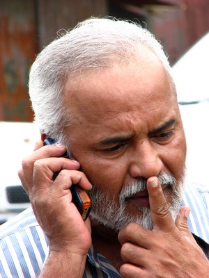 man listening to cellphone