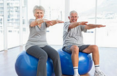 senior-couple-exercising-indoors